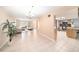 Open living room with tile flooring, ample natural light, and neutral decor at 1371 Meredith Dr, Spring Hill, FL 34608