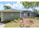 Exterior view of the home, showcasing a tidy landscape and well-maintained facade at 14053 Notreville Way, Tampa, FL 33624