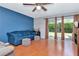 Inviting living room features hardwood floors, natural light, and access to a backyard at 14053 Notreville Way, Tampa, FL 33624