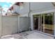 Enclosed patio with privacy fence and sliding glass door to indoor living space at 14053 Notreville Way, Tampa, FL 33624