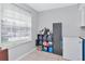 Efficient storage space with freezer, shelving, and good natural light at 14053 Notreville Way, Tampa, FL 33624