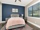 Cozy bedroom with a plush bed, stylish rug, and a relaxing reading nook by the bright window at 150 Chippewa Ave, Tampa, FL 33606