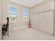 Bright bedroom with built-in murphy bed, cabinetry, desk, and two sunny windows at 150 Chippewa Ave, Tampa, FL 33606