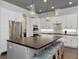 Beautiful open kitchen with a large center island, stylish pendant lights, and stainless steel appliances at 150 Chippewa Ave, Tampa, FL 33606
