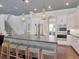 Modern kitchen with a large island, stainless steel appliances, and seamless access to a cozy living space at 150 Chippewa Ave, Tampa, FL 33606