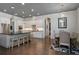 Open kitchen with a large island, modern lighting, stainless steel appliances, and a connected dining area at 150 Chippewa Ave, Tampa, FL 33606