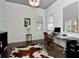 Bright office space with modern desk, windows, and hardwood floors at 150 Chippewa Ave, Tampa, FL 33606