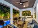 An inviting covered patio with grill and bar overlooking the pool at 150 Chippewa Ave, Tampa, FL 33606