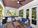 Inviting covered patio with a built-in grill, comfortable seating, and stylish decor for outdoor relaxation at 150 Chippewa Ave, Tampa, FL 33606