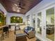 Inviting covered patio features an outdoor kitchen, comfortable seating, and seamless access to indoor living spaces at 150 Chippewa Ave, Tampa, FL 33606