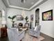 Formal sitting room with designer light fixture and ample seating at 150 Chippewa Ave, Tampa, FL 33606