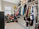 Large walk-in closet with custom shelving, rods, and plenty of storage space for shoes and clothing at 150 Chippewa Ave, Tampa, FL 33606