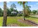 A gazebo in the back yard surrounded by trees and hedges at 15702 Richboro Ct, Tampa, FL 33647