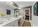 Bathroom featuring marble double vanity with ample storage and stylish decor at 15702 Richboro Ct, Tampa, FL 33647