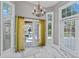 Bright breakfast nook with large windows and patio doors overlooking the pool area, enhancing indoor-outdoor living at 15702 Richboro Ct, Tampa, FL 33647