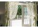 Outdoor deck view with yellow floral curtains at 15702 Richboro Ct, Tampa, FL 33647