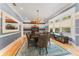 Elegant dining room featuring a beautiful chandelier, colorful walls, and a large window for natural light at 15702 Richboro Ct, Tampa, FL 33647