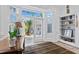 Bright entryway with transom windows, white shelving, and an open door to the outdoor area at 15702 Richboro Ct, Tampa, FL 33647