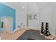 Bright exercise room with gym equipment and natural light at 15702 Richboro Ct, Tampa, FL 33647