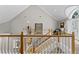 Bright foyer with vaulted ceilings, wood railing, and a view to the first floor at 15702 Richboro Ct, Tampa, FL 33647