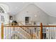 Bright foyer with vaulted ceilings, wood railing, and a view to the first floor at 15702 Richboro Ct, Tampa, FL 33647