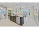 Spacious kitchen features a large island with stainless steel appliances, plenty of cabinets and an eat-in breakfast nook at 15702 Richboro Ct, Tampa, FL 33647
