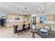 Bright eat-in kitchen featuring an island with seating, stainless steel appliances, and ample cabinetry at 15702 Richboro Ct, Tampa, FL 33647