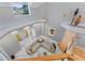 Aerial view of open living room with white sofa, fireplace and views to the backyard at 15702 Richboro Ct, Tampa, FL 33647