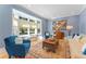 Bright and airy living room featuring large bay window, comfortable seating, and stylish decor at 15702 Richboro Ct, Tampa, FL 33647