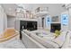 Open living room showcases marble floors, entertainment center, fireplace, and elegant staircases to upper level balconies at 15702 Richboro Ct, Tampa, FL 33647