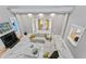 Spacious living room with high ceilings, marble floors, a fireplace, and ample seating at 15702 Richboro Ct, Tampa, FL 33647