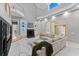 Open living room with high ceilings, fireplace, and marble flooring at 15702 Richboro Ct, Tampa, FL 33647