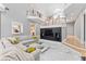 Spacious living room features a built-in entertainment center, marble floors, and access to upper-level balconies at 15702 Richboro Ct, Tampa, FL 33647