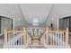 Upper floor loft with detailed ceilings, wood railings, and lots of natural light at 15702 Richboro Ct, Tampa, FL 33647