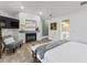 Bright and airy main bedroom with a fireplace, TV, and ensuite bathroom access at 15702 Richboro Ct, Tampa, FL 33647