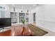 Home office showcasing built-in shelving, panelled walls, and a well-lit space for focused work or study at 15702 Richboro Ct, Tampa, FL 33647