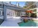Screened-in pool with lounge seating, hot tub, and elegant outdoor living space at 15702 Richboro Ct, Tampa, FL 33647