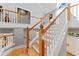 Wooden staircase with white railing leads to the second floor in this home at 15702 Richboro Ct, Tampa, FL 33647