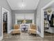 Spacious walk-in closet with custom shelving, dual entryways, and modern lighting at 15702 Richboro Ct, Tampa, FL 33647