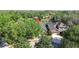 Aerial view of a home with mature trees, nestled in a serene neighborhood setting at 15861 Starling Water Dr, Lithia, FL 33547