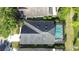 Aerial view of the property showcasing the roof, pool, and screened-in lanai at 15861 Starling Water Dr, Lithia, FL 33547