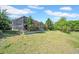 Large backyard with a screened lanai, offering a great outdoor space and a well-maintained lawn at 15861 Starling Water Dr, Lithia, FL 33547