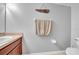 The bathroom features a wood vanity and beige walls at 15861 Starling Water Dr, Lithia, FL 33547