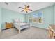 This bedroom features lots of light and a ceiling fan at 15861 Starling Water Dr, Lithia, FL 33547