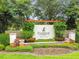Welcoming FishHawk Ranch community sign with beautifully landscaped entrance at 15861 Starling Water Dr, Lithia, FL 33547