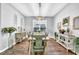 Well-lit dining room with hardwood floors and a decorative table setting at 15861 Starling Water Dr, Lithia, FL 33547