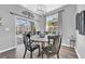 Cozy dining room with backyard views and a modern light fixture at 15861 Starling Water Dr, Lithia, FL 33547