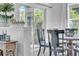 Dining room featuring a wooden table with a sliding glass door looking out to greenery at 15861 Starling Water Dr, Lithia, FL 33547