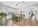Dining room with wood floors and a window, adjacent to the living room at 15861 Starling Water Dr, Lithia, FL 33547