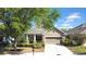 Charming single-story home featuring a well-manicured lawn, a two-car garage, and a welcoming entrance at 15861 Starling Water Dr, Lithia, FL 33547